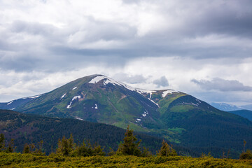 Wonderful nature. Rocky land, high mountains, dramatic sky.