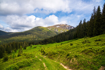 Wonderful nature. Rocky land, high mountains, dramatic sky.