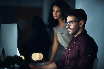 Business people, computer and night teamwork for planning, collaboration or solution at tech company. Leader or programmer problem solving with software update and cloud computing in office and bokeh