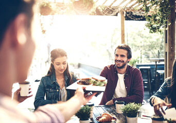 Hand, waiter and happy customer for food in restaurant with friends for date or lunch in Los Angeles. People, smile and satisfied with order for brunch at cafe in hospitality and service for reunion