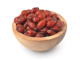 Wooden bowl of dried rose hips