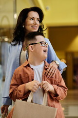 A mother and her son with Down syndrome share a happy moment while shopping in a mall.