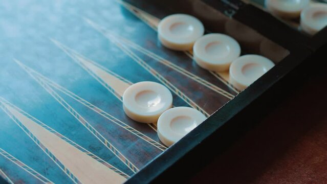 Close-up playing backgammon. Checkers black and White 