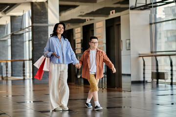 A mother and her son with Down syndrome enjoy a shopping mall outing. © Bliss