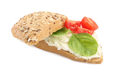 Pieces of bread with cream cheese, basil leaves and tomato isolated on white