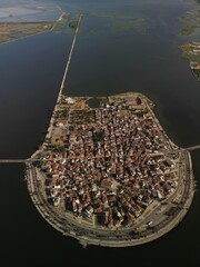 Aerial drone view of the famous island - fishing village of Aitoliko in Aetolia - Akarnania, Greece situated in the middle of Messolongi archipelago 