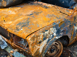 Burnt car. Traces of Russian shelling and fire.