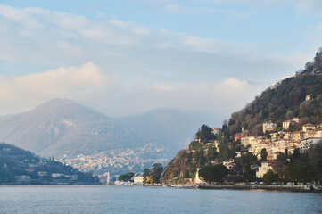 Obraz premium Scenic view of Lake Como with hillside villas and mountains in the background