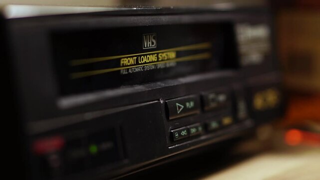 Starting Playback of VHS Video Cassette Tape, Inserting and Pressing Play Button on VCR, Close Up