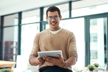 Portrait, tablet and happy business man in office for research, email or info online in startup. Face, graphic designer and creative professional entrepreneur in glasses to work on project in Brazil