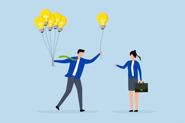 Business idea, businessman giving lightbulb idea to young employee.