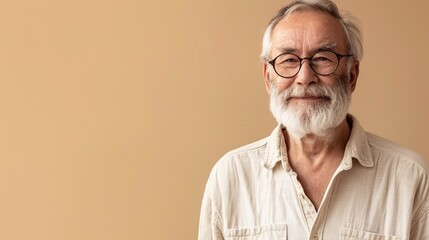 Fototapeta premium portrait of an elderly man on a beige background