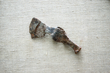 Scythian battle ax covered with rusty