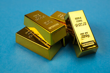 gold bars on a blue