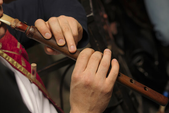 Folk musician playing the duduk .