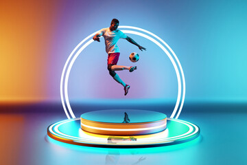 Dynamic image of African-American man, soccer player in motion with ball on podium with led circle...