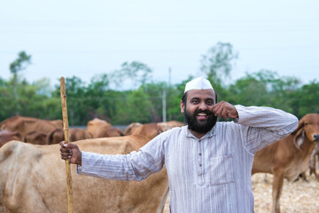 Young Indian Farmer and His Dairy Cows