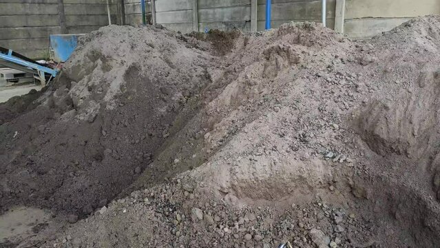 A pile of ash or sand material from the remains of coal burning or what is called 'Bottom Ash'