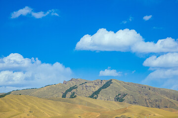 Aba, Sichuan Province - mountains and grasslands under the blue sky