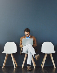 Job search, man and waiting room for interview with laptop, hiring or recruitment for internship....