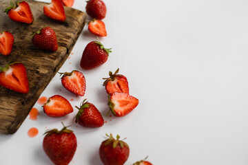 close-up with selective sharpness on a piece of cut strawberries on the table
