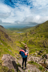 Girl is looking towards Devils Ladder, one of most difficult trails, that is leading to highest...