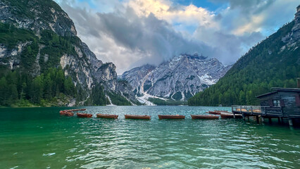 italian alps dolomites national park lake mountain trekking peaks tre cime brais lake carezza lake reflection clouds