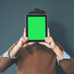 Green screen, tablet and hands of businessman in studio with mockup for hiring, recruitment or newsletter sign up on grey background. Digital, space and recruiter with social media, promo or info