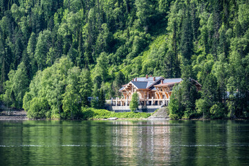 Obraz premium typical summer landscape with mountains, lake and forest in the area of ​​Lake Teletskoye in Altai