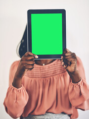 Green screen, tablet and hands of woman in studio with space for social media, chat or streaming on...