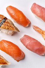 Sushi roll in tobiko caviar with salmon on a black board