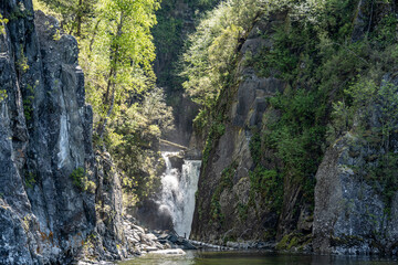summer panoramic landscape of mountains and forest and waterfall against the sky in the area of ​​Lake Teletskoye in Altai