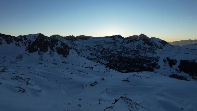 Aerial video over Coll blanc KSB ski resort, Andorra in a snowy winter