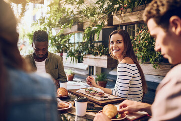 Group of people, woman and portrait at lunch with colleagues for business meeting or team building. Coworkers, positive and cheerful in restaurant for celebration or success in collaboration for work