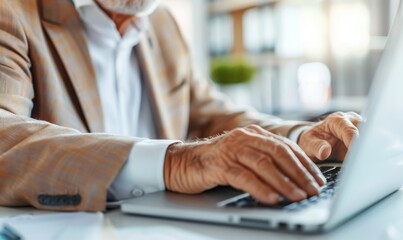 close-up photograph of man typing on a keyboard