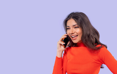 Smiling Woman Talking On Phone Against Purple Background