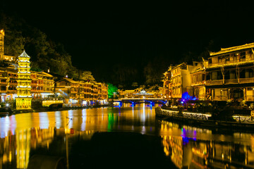 Fototapeta premium Phoenix Ancient Town, Xiangxi, Hunan Province - panoramic night view of the city scenery