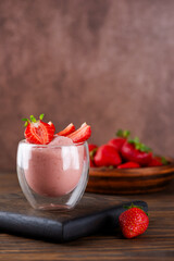 Whipped tofu and strawberry mousse dessert. Vegan food. Vertical orientation.