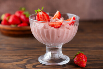 Whipped tofu and strawberry mousse dessert in a glass bowl. Vegan food.