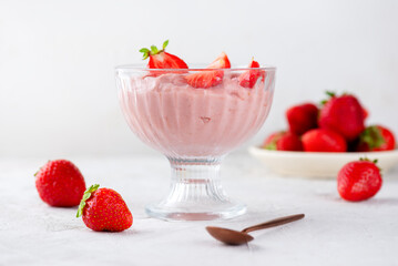 Vegan whipped tofu and strawberry mousse dessert in a glass. Lactose and sugar free.