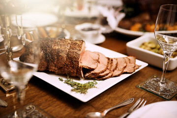Holiday dinner, home or table with roast beef for Christmas meal, cut meat or luxury cooking in house. Vacation, kitchen or grill steak for protein with festive season, party with food for wellness