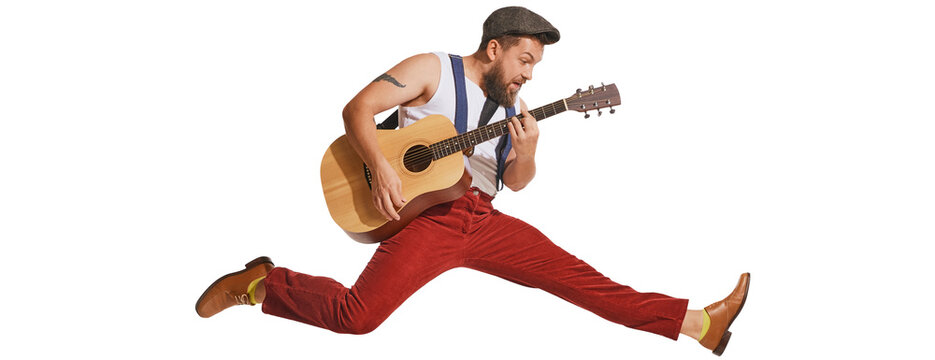 Expressive musician wearing retro style clothes playing guitar like rockstar isolated on transparent background. Vintage fashion, music, art, emotions, music festiva concept. Copy space for ad