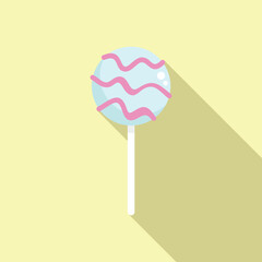 Blue cake pop with pink icing is casting long shadow on yellow background