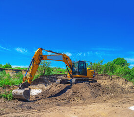 Crawler excavator, earthmoving equipment. Land clearing, foundation digging, construction work.