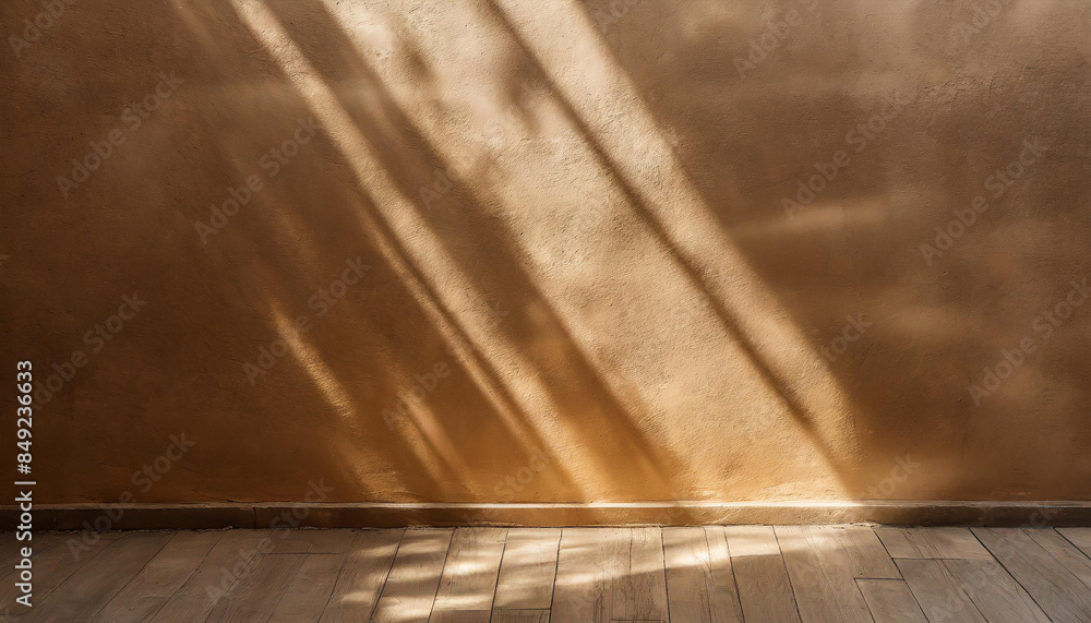 Poster minimalistic background of empty beige brown wall with sun rays for presentation, texture