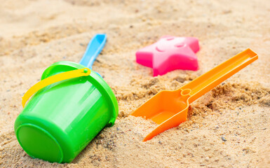 Sandbox with various outdoor toys. 
Sandbox for children's games. Summer concept.