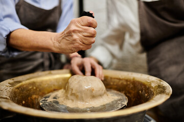 A lesbian couple enjoys a cozy pottery workshop, shaping clay into beautiful creations.