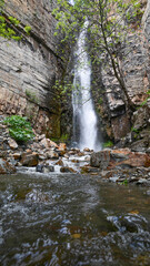 Obraz premium Tall waterfall wall art. Hight waterfall print set. Rocky mount and cascading waterfall. Beautiful waterfall picture