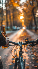 a person riding a bike with alcohol in their hand
