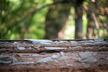 Smashed glass Window with old wooden frame. old window. finely broken glass. old house, retro. cracked window frame. cracked old paint, pieces of glass. close-up, space for text. horror, war